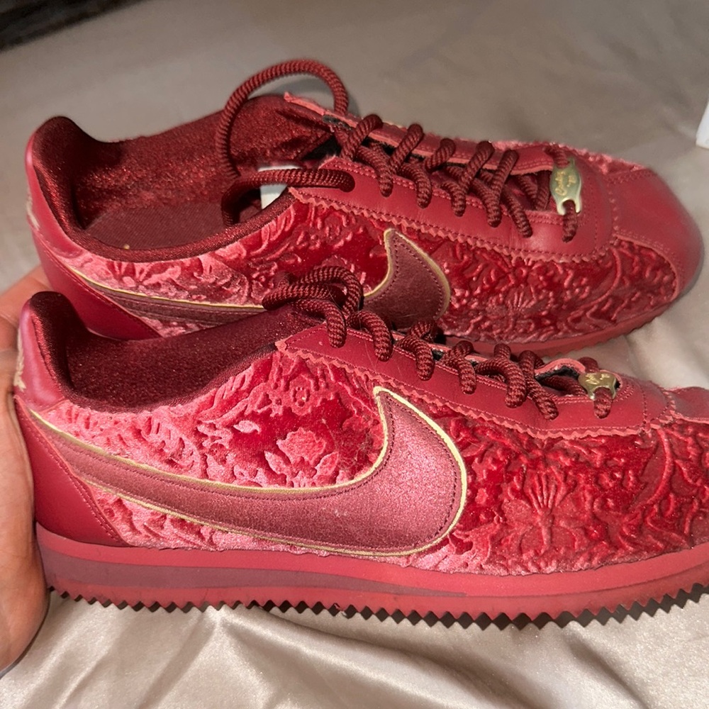 Red and gold Nikes